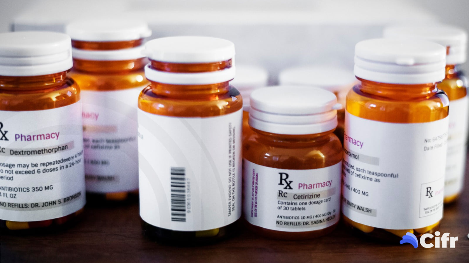 Rows of serialised prescription bottles, each carrying a scannable label that verifies as genuine